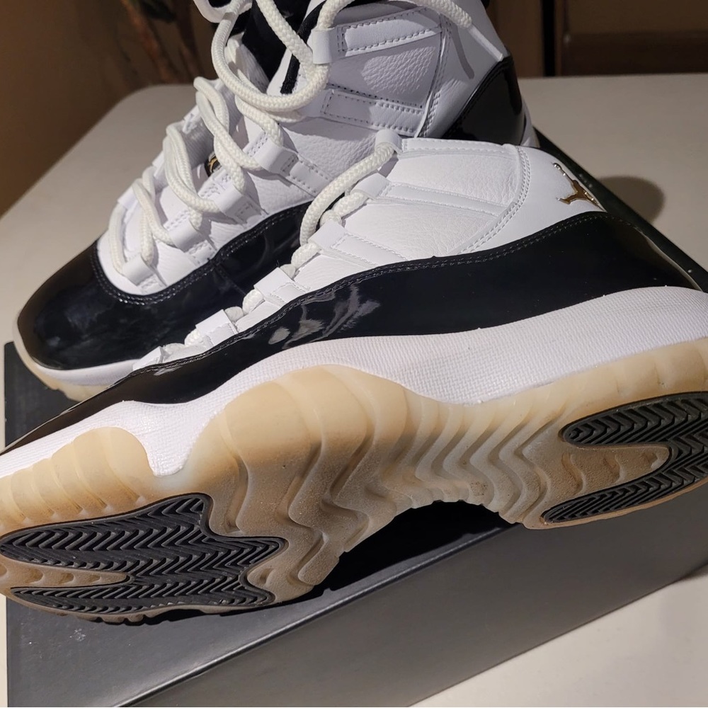 Air Jordan 11 Retro Black White and Gold